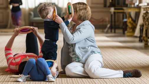 Room guide with visitors in the Long Gallery at Sudbury Hall and the National Trust Museum of Childhood, Derbyshire